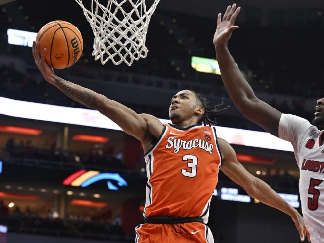 Mar 2, 2024; Louisville, Kentucky, USA; Syracuse Orange guard Judah Mintz (3) shoots against Louisville Cardinals forward Brandon Huntley-Hatfield (5) during the first half at KFC Yum! Center. Mandatory Credit: Jamie Rhodes-USA TODAY Sports