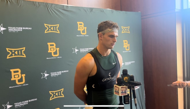 Sawyer Robertson speaks to media after early fall practice