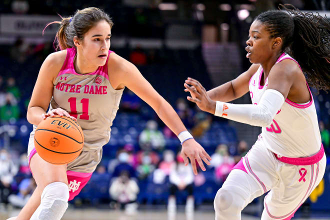 Notre Dame guard Sonia Citron (11) dribbles the ball as Miami Hurricanes guard Kelsey Marshall (20) defends, Thursday night at Purcell Pavilion in South Bend, Ind.