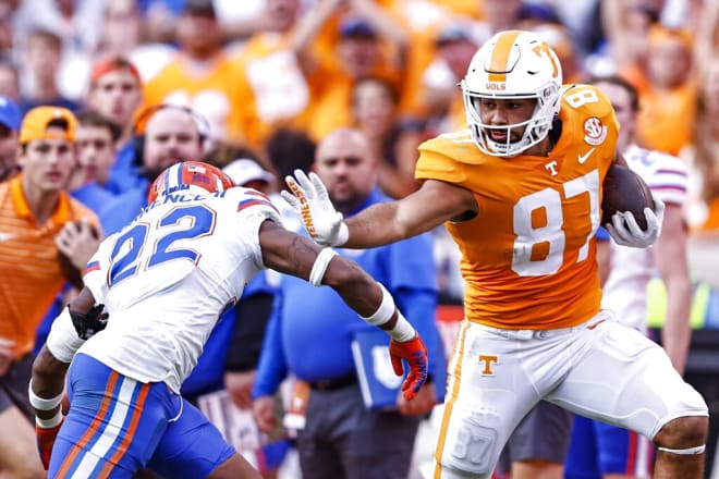 Tennessee tight end Jacob Warren (87) stiff arms Florida safety Rashad Torrence II (22) during the second half of an NCAA college football game Saturday, Sept. 24, 2022, in Knoxville, Tenn. Tennessee won 38-33. (AP Photo/Wade Payne)