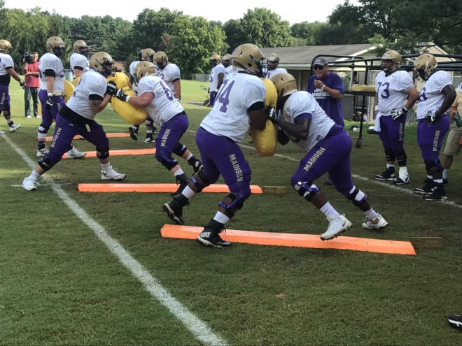 James Madison's offensive line drills during practice on Tuesday in Harrisonburg.