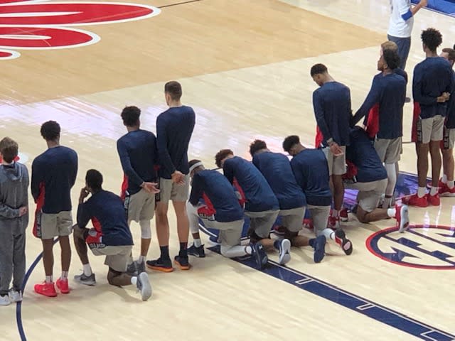 Devontae Shuler (sixth from left, in gray headband) was one of eight Ole Miss players to kneel as a form of protest against a pro-Confederate rally taking place in Oxford and at Ole Miss last weekend. Their decision, one that was completely supported by the university, made national news.