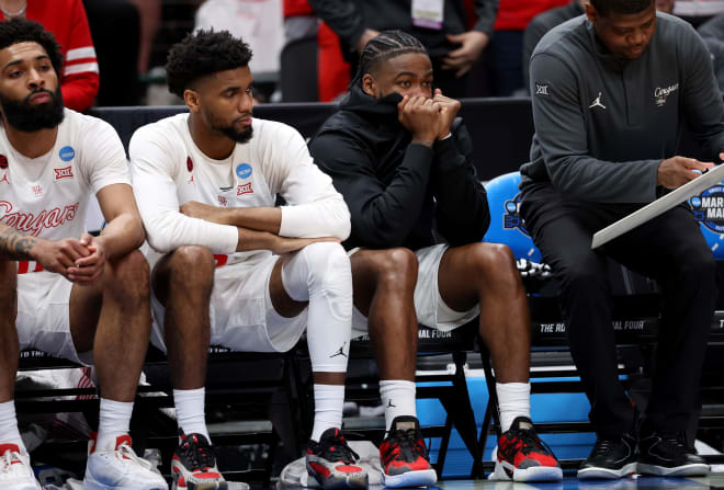 Houston's Jamal Shead, second from right, watches during the second half of Friday night's game. 