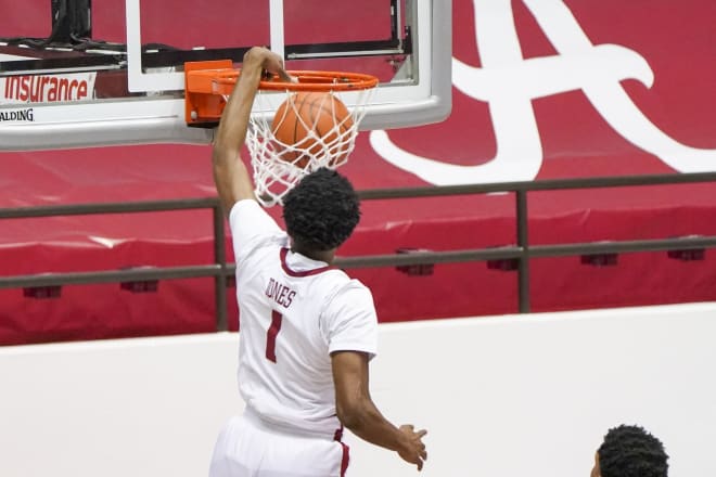 Alabama Crimson Tide forward Herbert Jones (1) dunks the ball against Auburn Tigers during the first half at Coleman Coliseum. Photo | Imagn