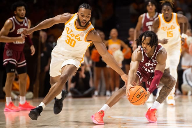 Tennessee guard Josiah-Jordan James (30) and South Carolina guard Meechie Johnson (5) go after a loose ball during a basketball game between Tennessee and South Carolina held at Thompson-Boling Arena at Food City Center on Tuesday, January 30, 2024.
