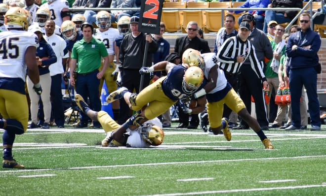 A duo of Irish defenders taking down tight end Alize Mack.