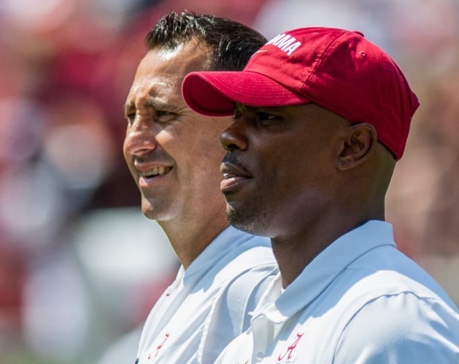 Alabama offensive coordinator Steve Sarkisian and wide receiver coach Holmon Wiggins watch warm ups at Bryant-Denny Stadium in Tuscaloosa, Ala., on Saturday September 7, 2019. Photo | USA Today