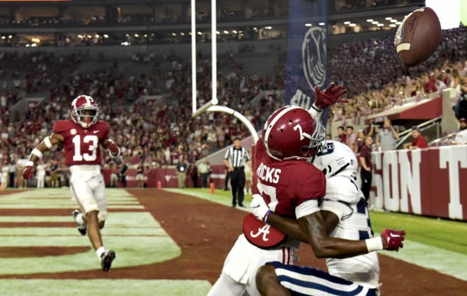 Alabama Crimson Tide defensive back Eli Ricks (7) breaks up a pass in the end zone intended for Utah State Aggies wide receiver Jalen Royals (37) at Bryant-Denny Stadium. Alabama won 55-0. Photo | Gary Cosby Jr.-USA TODAY Sports