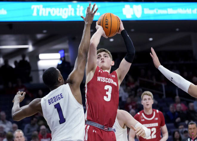 Wisconsin guard Connor Essegian (3) shoots against Northwestern guard Chase Audige. The Badgers went 10-for-31 from three-point range.