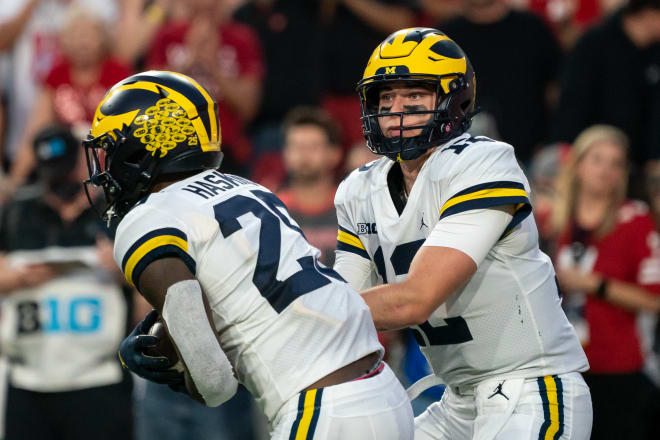 Michigan Wolverines Hassan Haskins and Cade McNamara