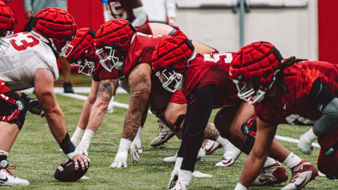 The Arkansas DL lines up in spring practice.