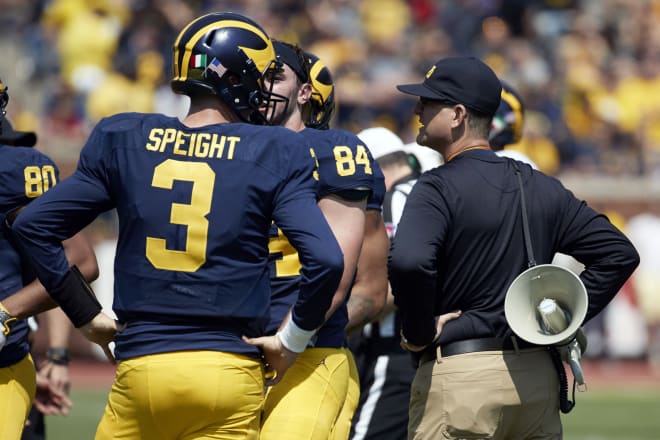 Quarterback Wilton Speight and head coach Jim Harbaugh talk strategy at the spring game.
