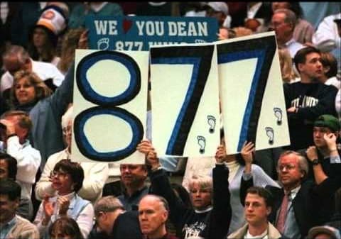 UNC fans hold up signs as Den Smith registers his 877th career win with an NCAA victory over Colorado.