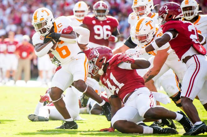 Tennessee running back Dylan Sampson (6) fights for extra yardage during a football game between Tennessee and Alabama at Bryant-Denny Stadium in Tuscaloosa, Ala., on Saturday, Oct. 21, 2023.