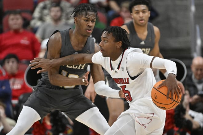 Hercy Miller pushes off on Miles Kelly during the first half of the Tech-Louisville game