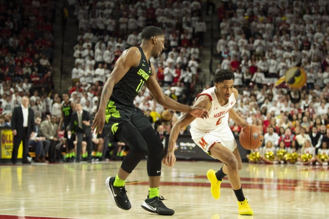 Aaron Wiggins (No. 2) drives on Michigan State's Aaron Henry during last year's meeting in College Park.