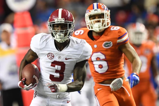 Alabama Crimson Tide wide receiver Calvin Ridley (3) runs the ball ahead of Florida Gators defensive back Quincy Wilson (6) during the second quarter of the SEC Championship college football game at Georgia Dome. Photo | USA Today