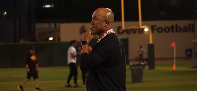 ASU's new WR's coach Hines Ward takes in the Sun Devils' Saturday night practice 
