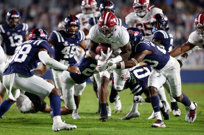 Alabama Crimson Tide running back Brian Robinson Jr. breaks through multiple Ole Miss defenders. Photo | Getty Images 