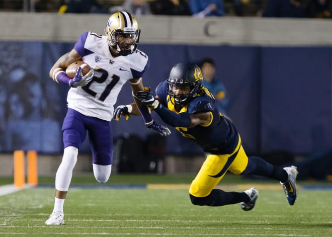 Washington Huskies wide receiver Quinten Pounds (21) carries the ball against California Golden Bears safety Jaylinn Hawkins (6) during the third quarter at Memorial Stadium. Photo by Kelley L Cox-USA TODAY Sports