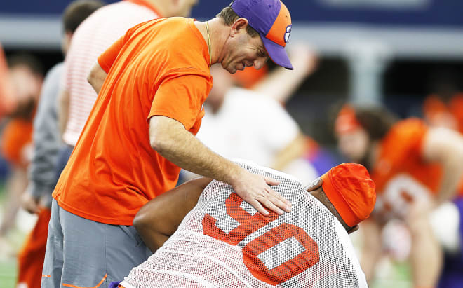 Clemson head coach Dabo Swinney is shown here with Dexter Lawrence in AT&T Stadium on Monday.  Lawrence is allowed to practice with the Tigers during the appeals process.