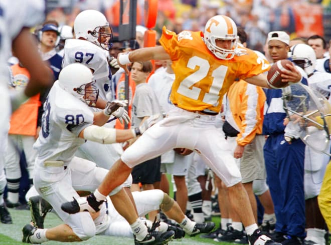 University of Tennessee quarterback Heath Shuler (21) is run out of bounds by Penn State defenders Rob Holmberg (80) and Tyoka Jackson (97) during first half action of the Citrus Bowl in Orlando, Fla., Jan. 1, 1994.