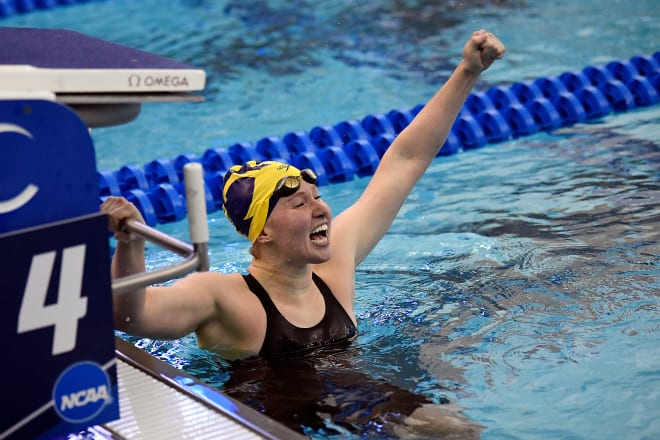 Michigan Wolverines women's swimming and diving junior Olivia Carter, a Georgia transfer, celebrates the national championship in the 200-yard butterfly event.