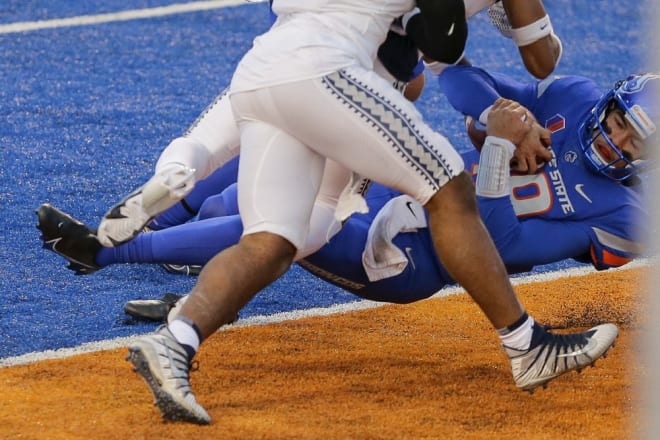 Boise State quarterback Hank Bachmeier (19) dives into the end zone on a 6 yard touchdown run against Utah State in the first half of an NCAA college football game Saturday, Oct. 24, 2020, in Boise, Idaho. Boise State won 42-13. (AP Photo/Steve Conner)