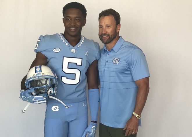 Storm Duck (pictured with Larry Fedora on Saturday) tells THI why he chose to Tar Heels after committing.