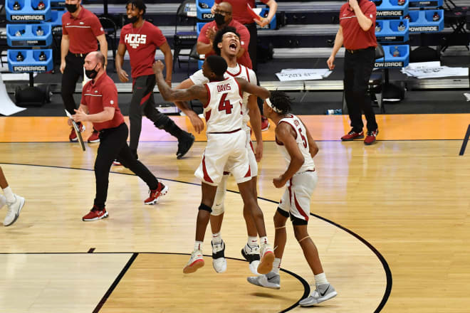 Arkansas freshmen Devo Davis, Jaylin Williams, Moses Moody celebrate round of 32 win.