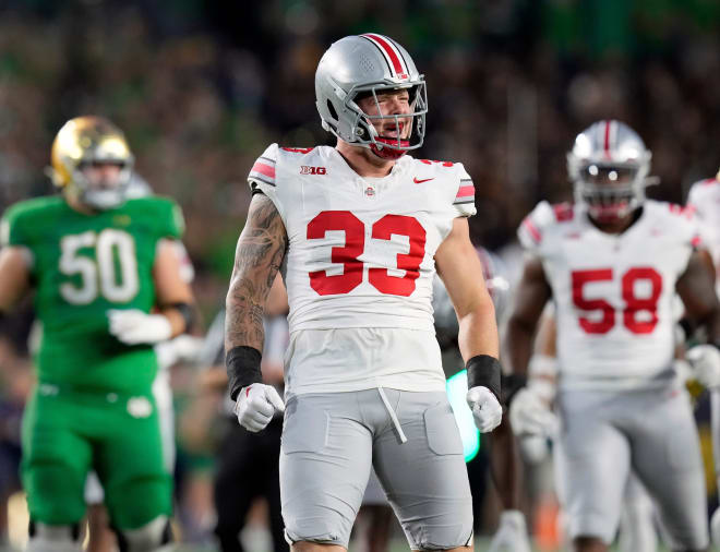 Ohio State defensive lineman Jack Sawyer (No. 33) celebrates a tackle against Notre Dame. 