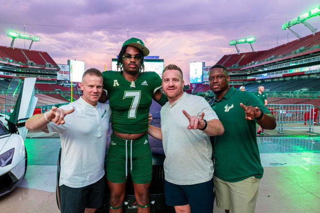Ward poses with USF coaches during his official visit to Tampa last weekend