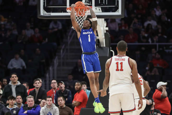 Dec 30, 2023; Elmont, New York, USA; Hofstra Pride guard Darlinstone Dubar (1) dunks in the second half against the St. John's Red Storm at UBS Arena.