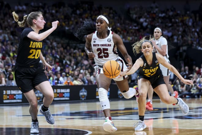 Mar 31, 2023; Dallas, TX, USA; Iowa Hawkeyes guard Gabbie Marshall (24) knocks the ball away from South Carolina Gamecocks guard Raven Johnson (25) in the first half in semifinals of the women's Final Four of the 2023 NCAA Tournament at American Airlines Center.