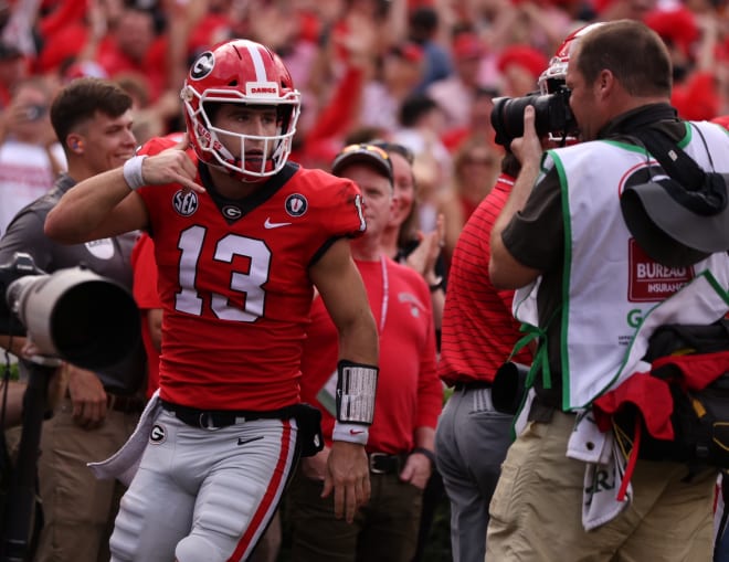Stetson Bennett celebrates after scoring one of his three total touchdowns. (Tony Walsh/UGA Sports Communications)