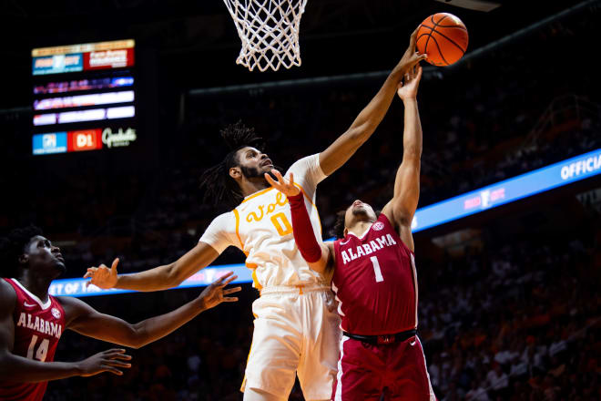 Tennessee forward Jonas Aidoo (0) blocks a shot by Alabama guard Mark Sears (1) during a NCAA basketball game at Thompson-Boling Arena in Knoxville, Tenn., on Wednesday, Feb. 15, 2023. Tennessee defeated No. 1 Alabama, 68-59.