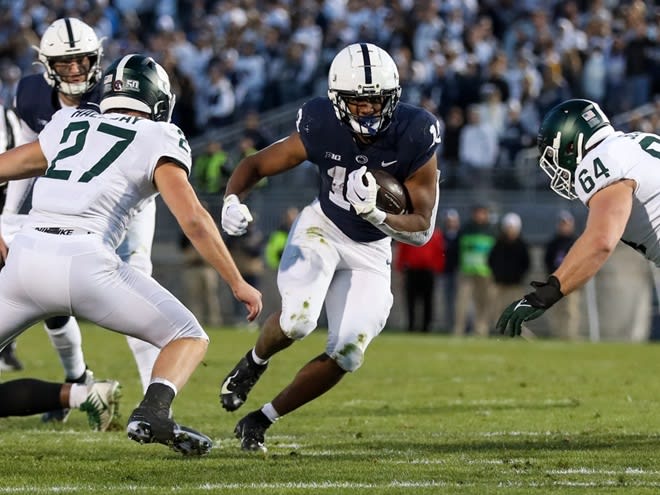 Penn State Nittany Lions running back Nicholas Singleton (10) runs with the ball during the first quarter against the Michigan State Spartans at Beaver Stadium. 