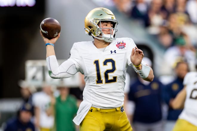 Notre Dame Fighting Irish quarterback Tyler Buchner (12) throws the ball during the first half against the South Carolina Gamecocks in the 2022 Gator Bowl at TIAA Bank Field. Photo |  Matt Pendleton-USA TODAY Sports