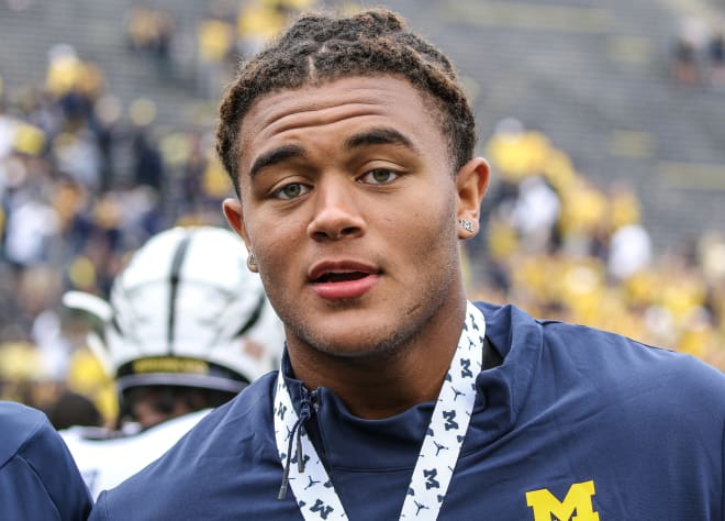 Four-star weakside defensive end has been thinking about Michigan for a long time and now he's committed.