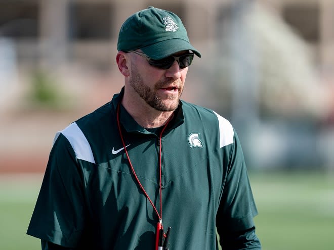 Michigan State co-special teams coordinator/rush ends Ccach Chad Wilt surveys the field during spring practice