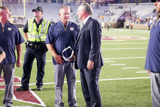 Director of athletics Jack Swabrbrick, with head coach Brian Kelly, has put Western Michigan on the 2020 schedule.