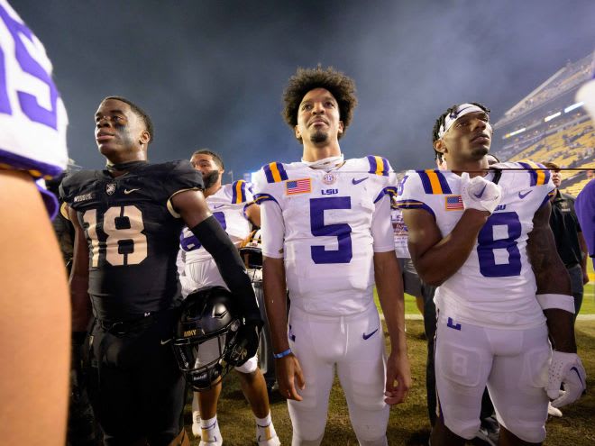 Army Black Knights linebacker Elo Modozie (18) & LSU Tigers quarterback Jayden Daniels (5)