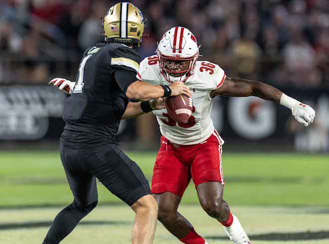 Linebacker Jack Chaney chases Purdue quarterback Hudson Card. 