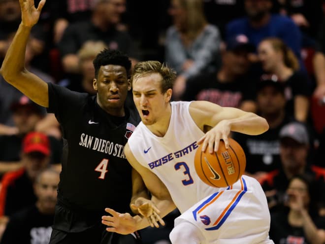 Boise State guard Anthony Drmic (3) battles San Diego State guard Dakarai Allen (4) during the first half of an NCAA college basketball game Saturday, Feb. 27, 2016, in San Diego.
