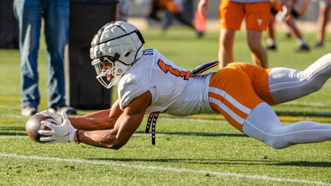 Tennessee freshman wide receiver Braylon Staley dives for a ball during a passing drill at the Vols' third spring practice on Thursday.