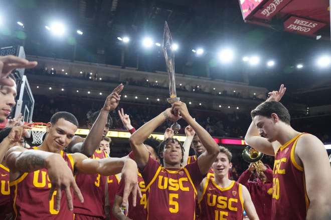 Boogie Ellis holds the sword after scoring a game-high 31 points in USC's 77-64 win over No. 8 UCLA.