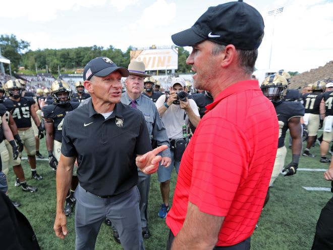 This end of game heated exchange between Army HC Jeff Monken and WKU HC was how both teams battled one another on Saturday .... to the end!