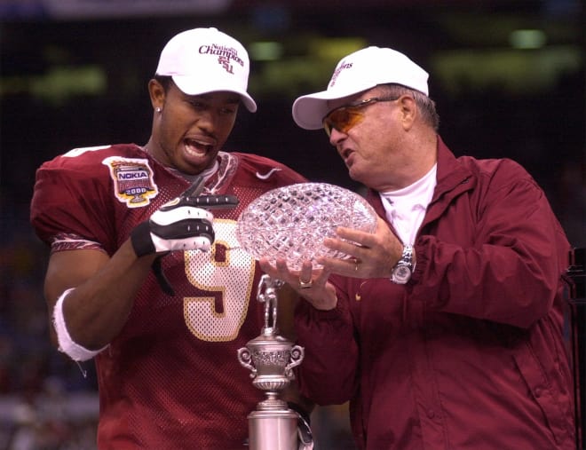 Peter Warrick and Bobby Bowden celebrate the Seminoles' 1999 national championship.