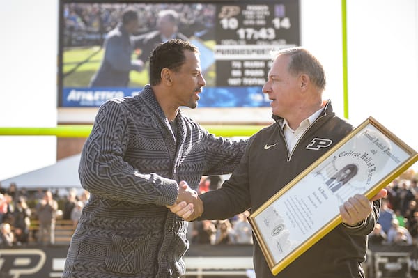 Rod Woodson is honored by Purdue AD Mike Bobinski in 2016 after earning a spot in the College Football Hall of Fame. 