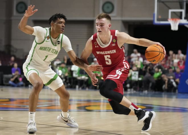 Wisconsin's Tyler Wahl (5) drives arouns North Texas' Aaron Scott (1). He finished the game with 12 points and seven rebounds.